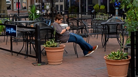 Elyse checks her phone on the Downtown Mall