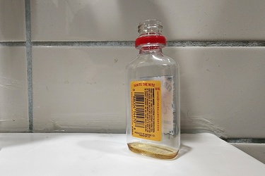 Discarded bottle of Fireball