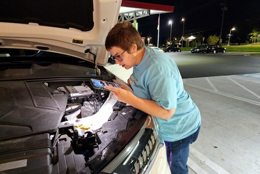 Elyse looks under the hood of an Audi Q7 [01]