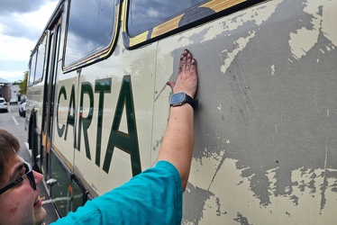 Elyse works on some adhesive residue on former CARTA bus 3426