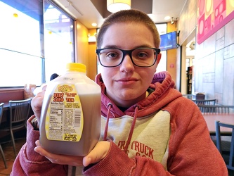 Elyse holds up a jug of Ritchey's Diet Iced Tea