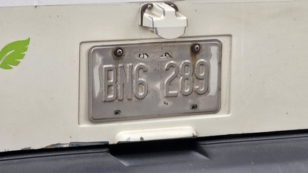 Worn license plate on Windsor bus 606