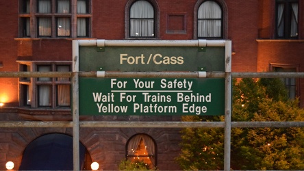 Trackside signage at Fort/Cass station