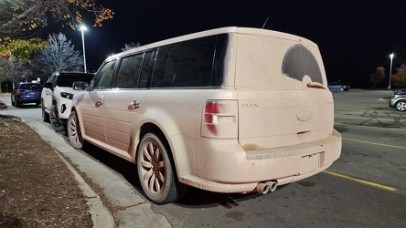 Ford Flex with a coating of something on its rear side