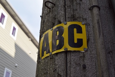 Power line configuration sign on a utility pole