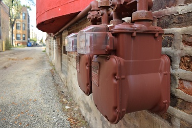 Gas meters along an alley