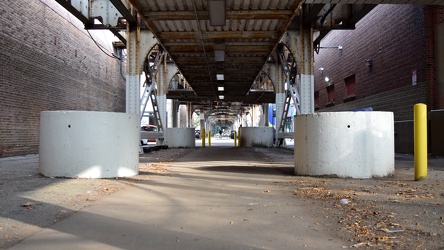 Concrete planters beneath the Brown Line tracks