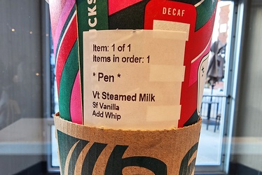 Steamed milk from Starbucks in a holiday cup [02]