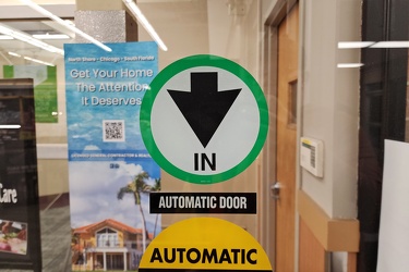 Downward-pointing arrow on entrance to Jewel-Osco