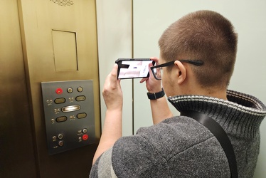 Elyse films the observatory elevator at 875 North Michigan Avenue