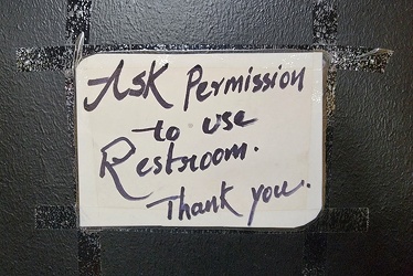 Sign on GoLo gas station restroom door