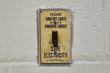 Energy saving reminder on light switch plate [01]