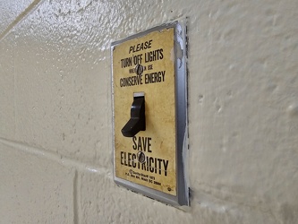 Energy saving reminder on light switch plate [02]