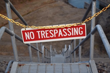 "NO TRESPASSING" sign on stairs [02]