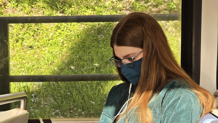 Woman looking at her phone on the Metro [02]