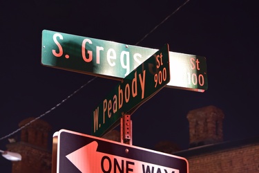 Street signs for South Gregson Street and West Peabody Street