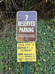 Reserved parking spot with handmade sign [01]