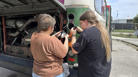 Elyse and Kyle work on taillights